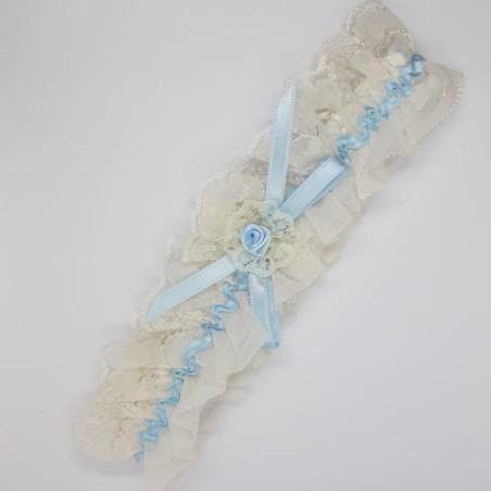 Liga novias encaje beige y lazo celeste decorativo. 