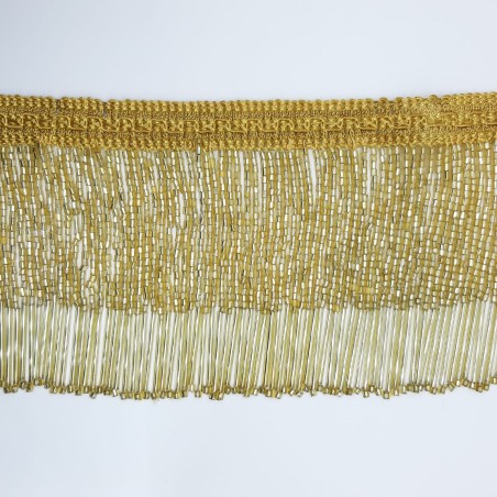 Fleco pedrería dorado.