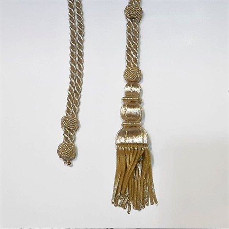 Cordón dorado metalizado brillante con fleco decorativo