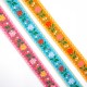 Galón tapacosturas con flores de colores de 2,5 cms