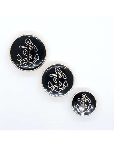 Botón ancla negro filo dorado.