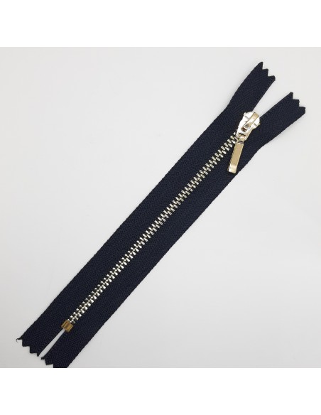 Cremallera metálica azul marino botella malla dorada.