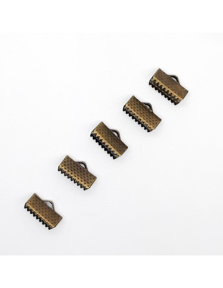 Cierre tope para cintas con garras 13 mm de color oro viejo