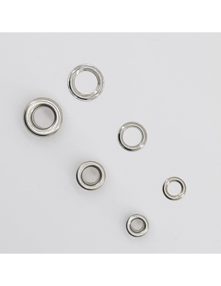 Ojete níquel latón con arandela de color plata