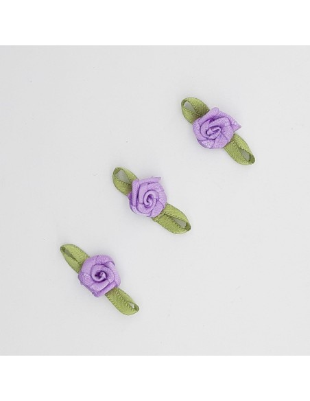 Flor de raso malva con lazo verde decorativo