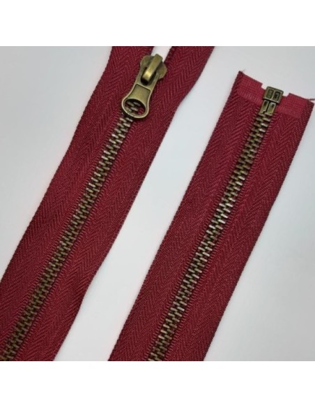 Cremallera separador metálica burdeos 65cms diente oro viejo.