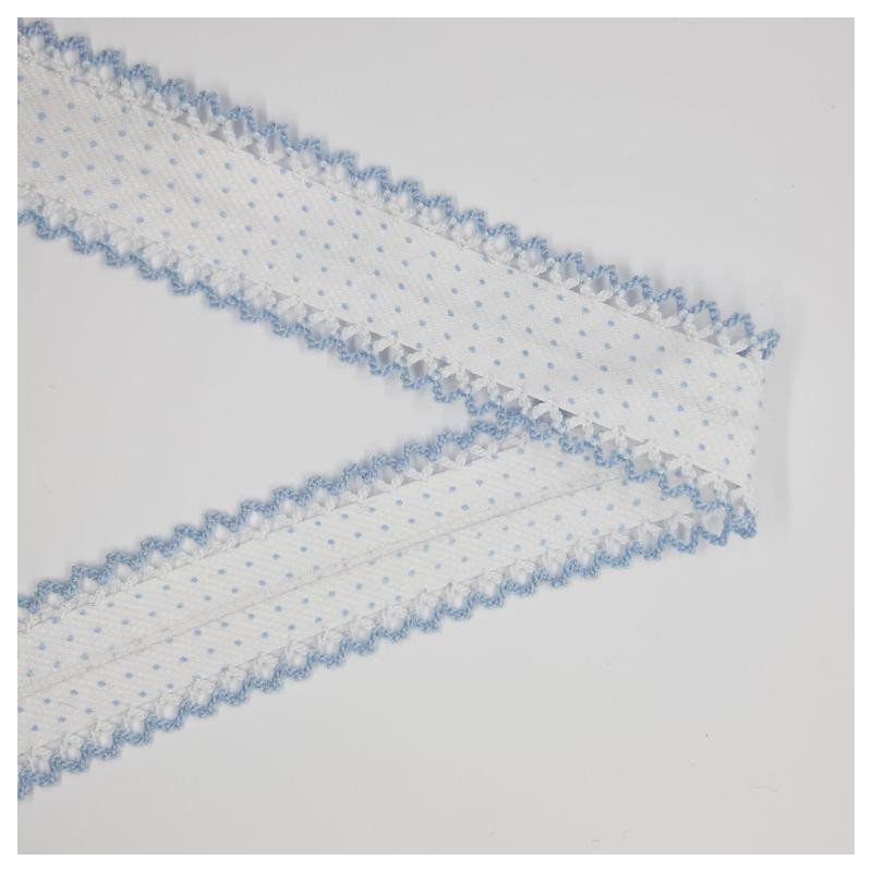 Cinta bies con lunares y puntas celeste.